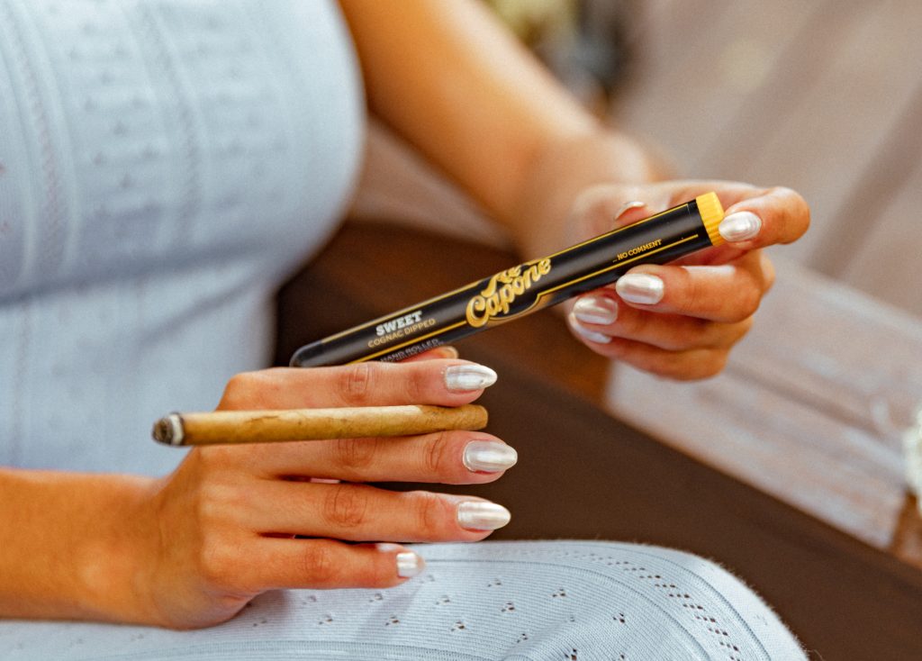 Best small cigars, the al capone sweets shown in woman's hands is a top pick