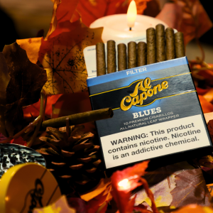 
Alt Text: Poker table with cards, chips, snacks, and a tray of Al Capone cigarillos for adult guests
