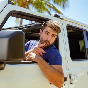 Car trunk packed with luggage, snacks, cooler, and Al Capone cigarillos for the journey